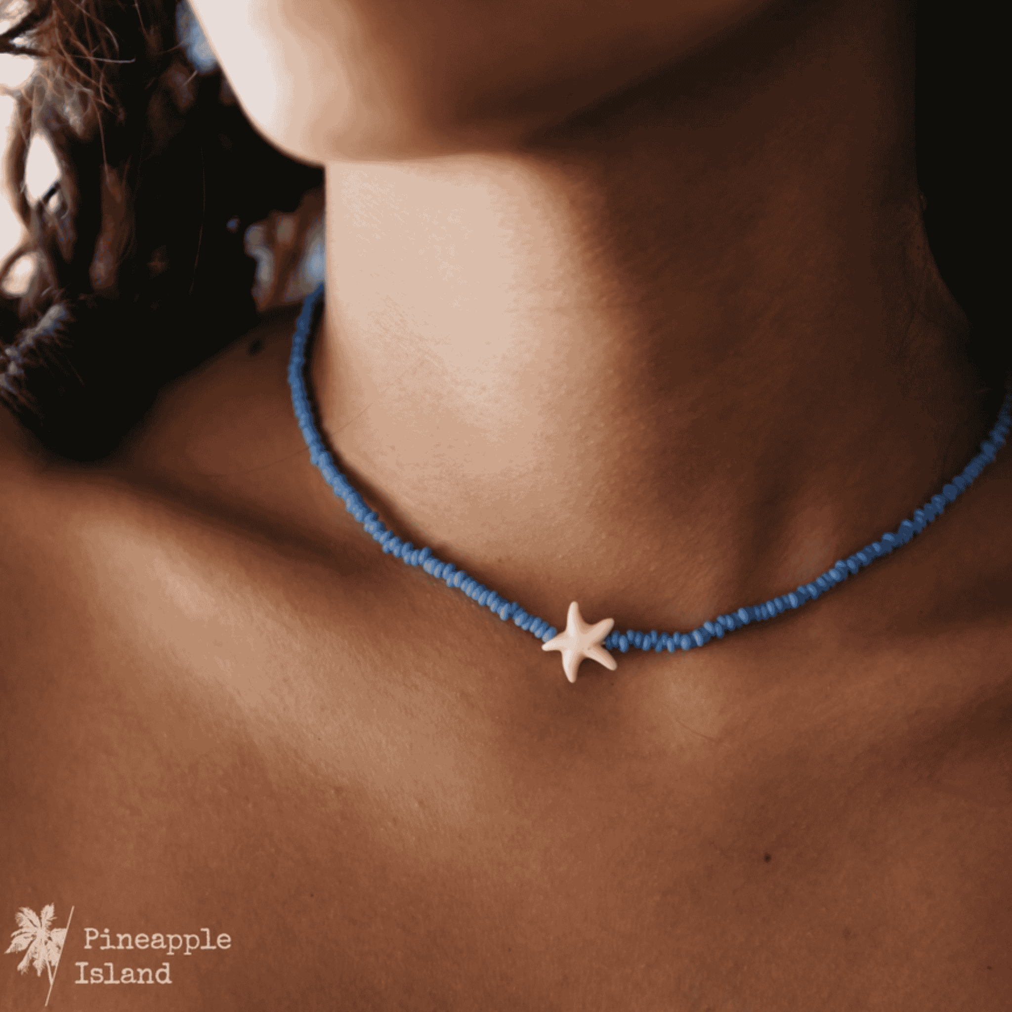 A delicate starfish charm necklace displayed on a light background; the dainty design evokes coastal beauty, perfect for beach lovers and ocean dreamers who want to carry a touch of the sea with them.