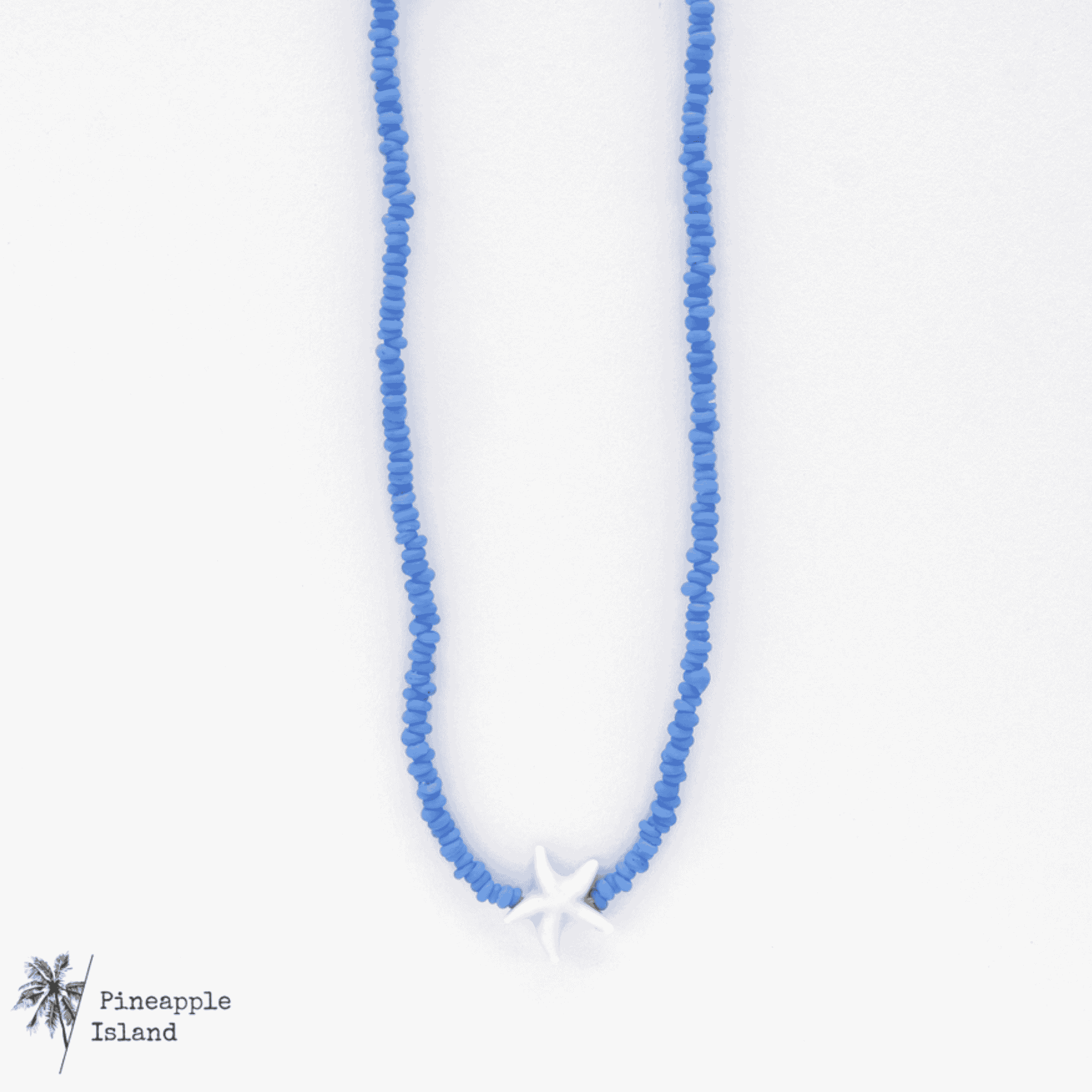 A delicate starfish charm necklace displayed on a light background; the dainty design evokes coastal beauty, perfect for beach lovers and ocean dreamers who want to carry a touch of the sea with them.