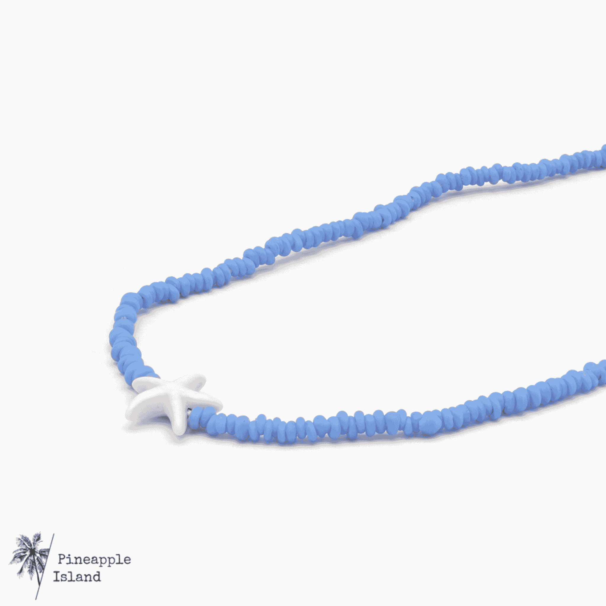 A delicate starfish charm necklace displayed on a light background; the dainty design evokes coastal beauty, perfect for beach lovers and ocean dreamers who want to carry a touch of the sea with them.