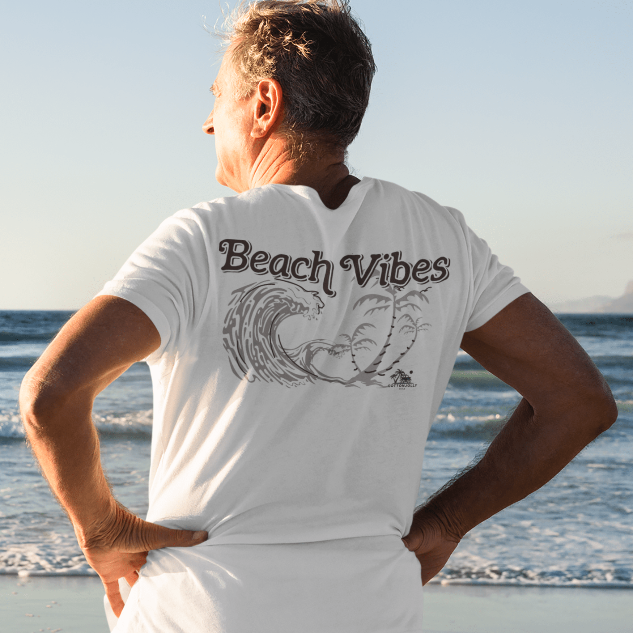 A women’s Beach Vibes Tee laid flat; made from 100% premium cotton, this ultra-soft, breathable t-shirt features a coastal-inspired design with gentle ocean waves, capturing the essence of beachside relaxation and carefree summer style.