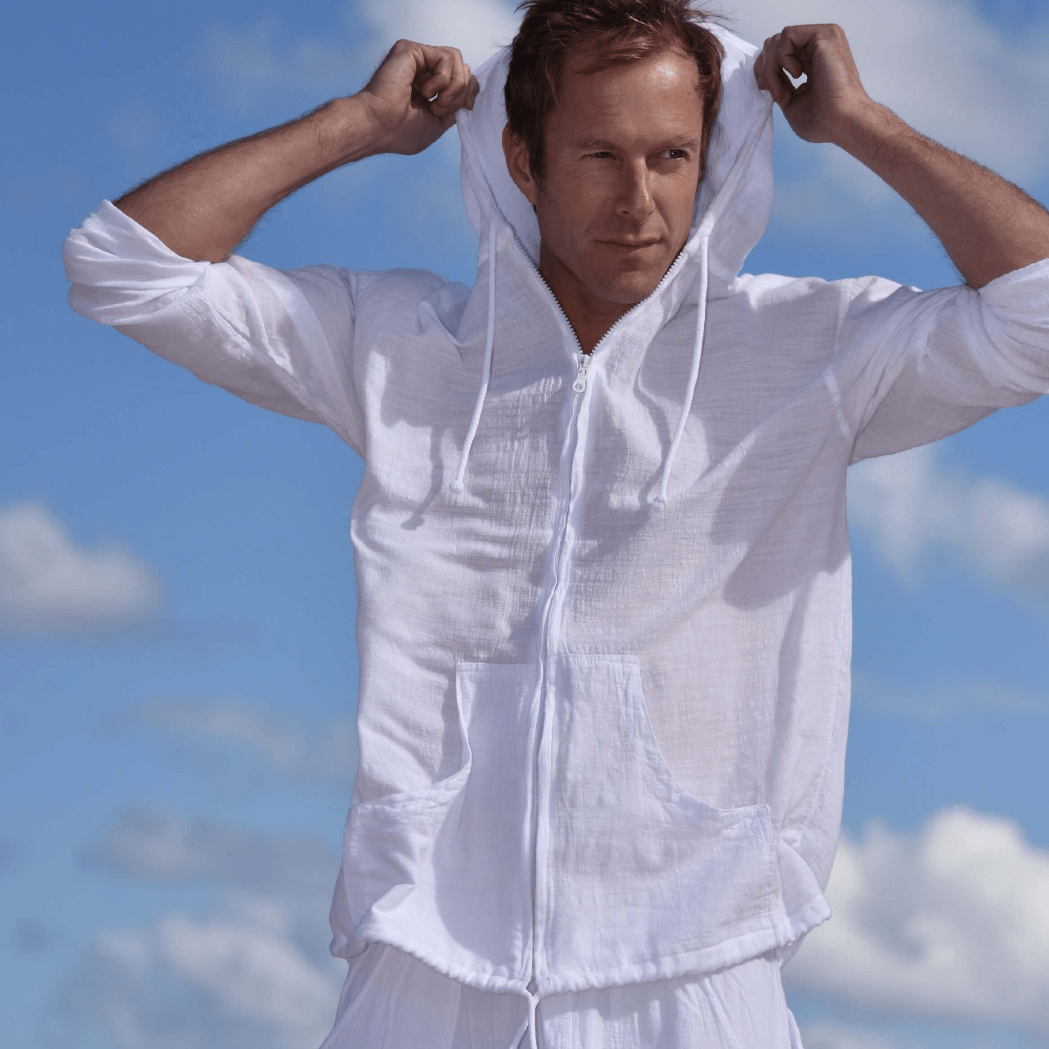 The Island Hoodie made from ultra-soft, breathable Cotton Natural fabric, featuring a relaxed fit and a convenient zippered front. Ideal for layering or casual wear, this versatile hoodie combines comfort and style for any season.