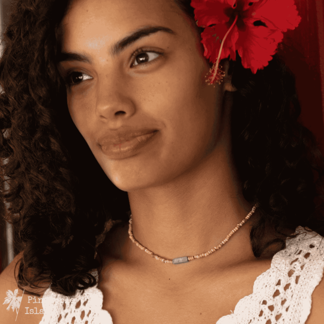 A choker and anklet duo featuring coconut wood beads and a natural stone with organic veining. The choker evokes tropical breezes, while the Bali-crafted anklet, with a double-beaded design and adjustable wax polyester pull-string, offers a bohemian, carefree fit. Perfect for adventurous souls embracing the rhythm of the waves.